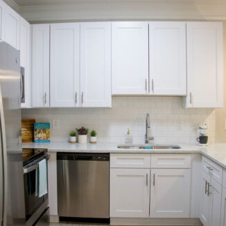 White cabinets lined in the kitchen